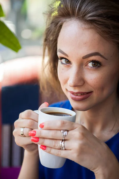 Woman drinking a cup of coffee