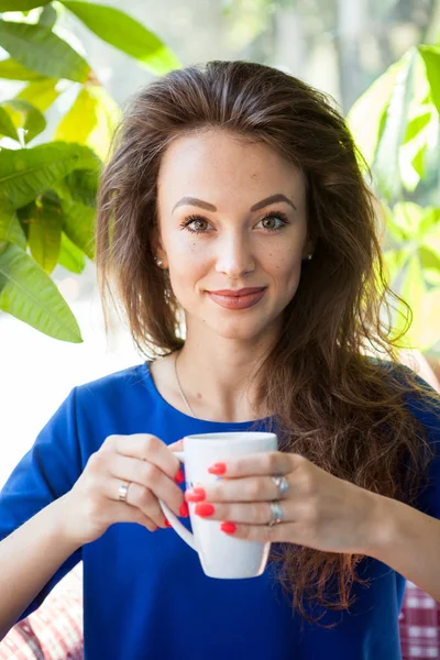 Gorgeous woman drinking a cup of coffee