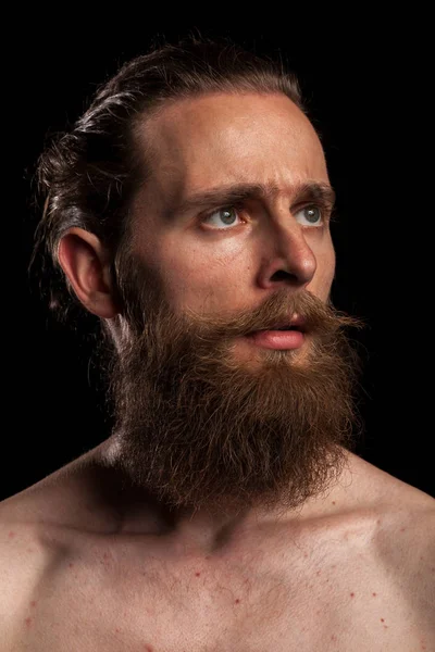 Portrait of cool tattooed bearded hipster on black background — Stock Photo, Image