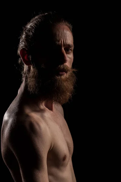 Portrait of bearded guy on black background — Stock Photo, Image