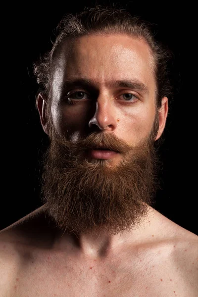 Cool tattooed bearded hipster on black background — Stock Photo, Image