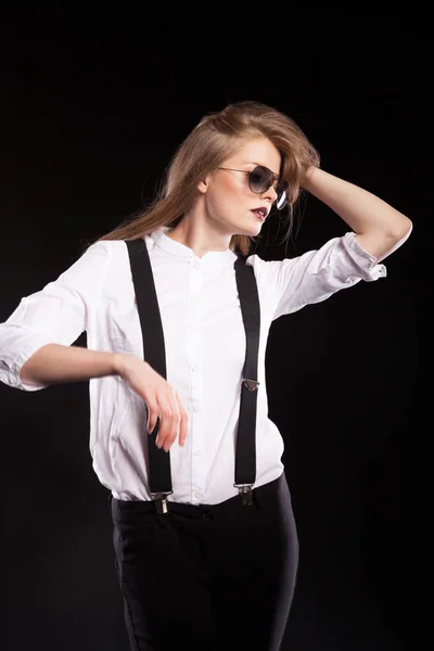 Blonde woman model with suspenders and white shirt