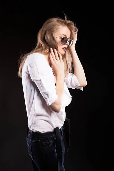 Beautiful blonde model with suspenders and white shirt