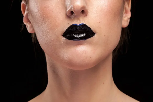 Woman with black lips on black background — Stock Photo, Image