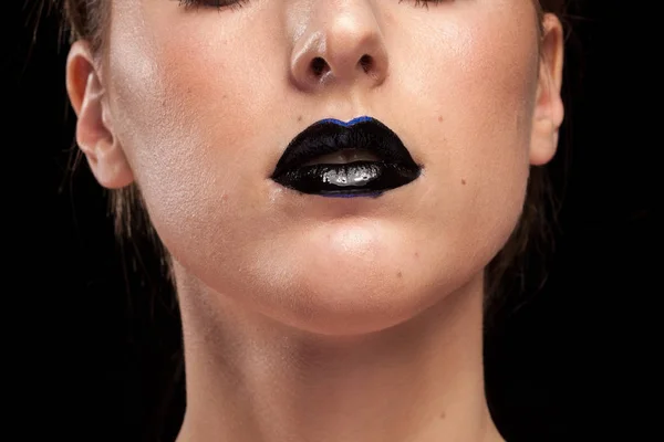 Woman with black lips on black background — Stock Photo, Image