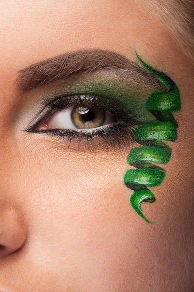 Close up of an eye with artistic make up — Stock Photo, Image