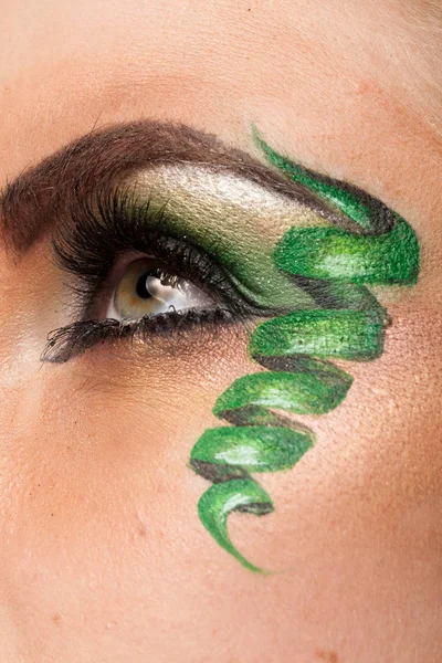 Close up of an eye with artistic make up — Stock Photo, Image