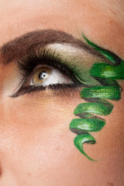 Close up of an eye with artistic make up — Stock Photo, Image