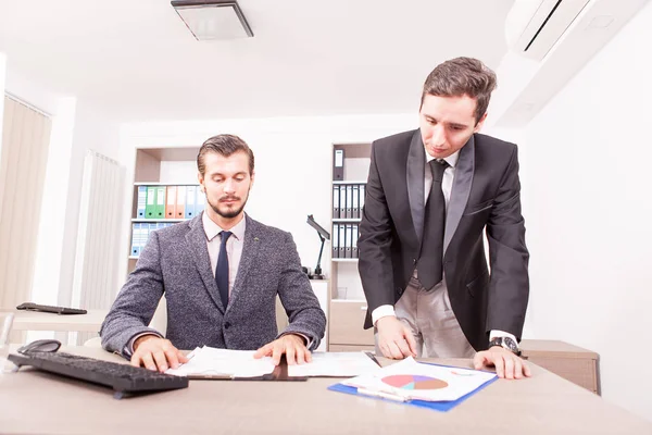 Professional Businessmans in formal suits working in office