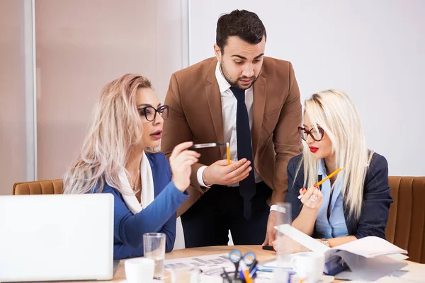 Team of business people at meeting in the conference room