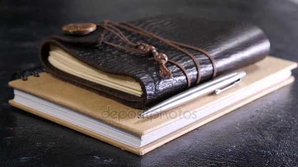 Leather vintage retro notebook on a dark table — Stock Video