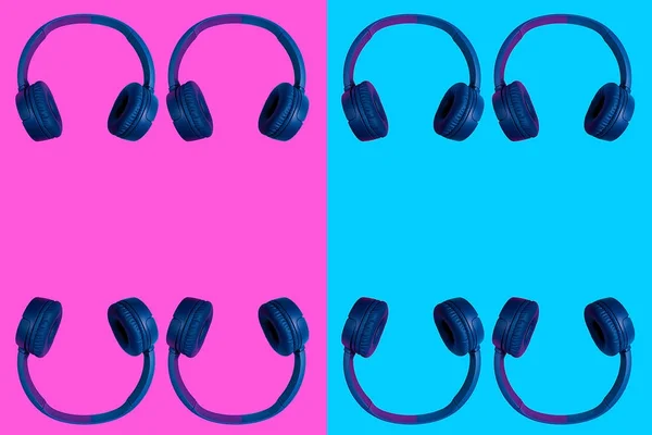 Plusieurs écouteurs sans fil doublés sur fond de couleur vive — Photo