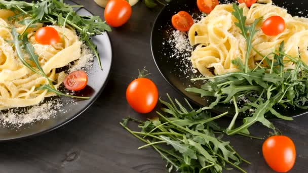 Delicious pasta in black plates — Stock Video