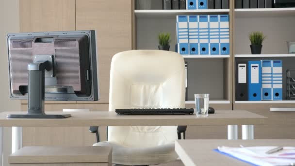 Empty modern office with computers and laptop on desks — Stock Video