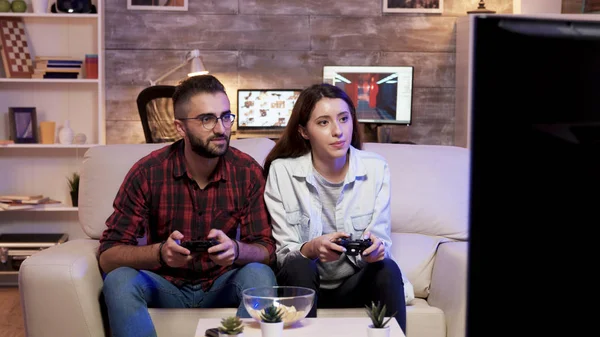 Couple giving high five after playing video games — Stock Photo, Image