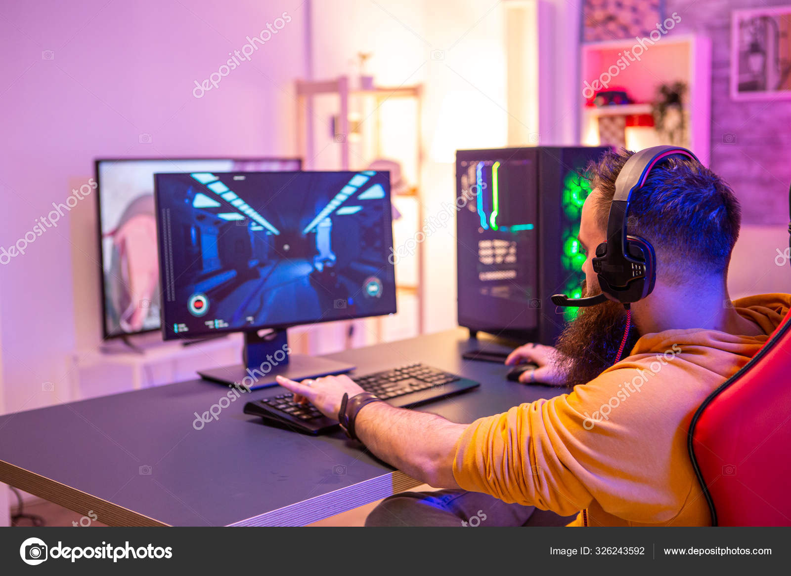 Free Photo  Player winning video games with controller and headset in  front of monitor. man using joystick and headphones, playing online games  on computer. person celebrating game win for leisure.