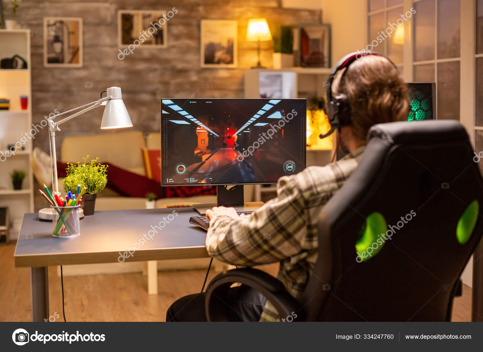 Free Photo  Gamer using controller to play online video games on computer.  man playing game with joystick and headphones in front of monitor. player  having gaming equipment, doing fun activity.