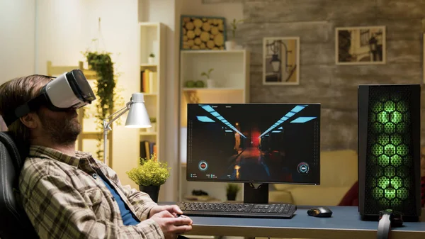 Man sitting on gaming chair playing video games — Stock Photo, Image