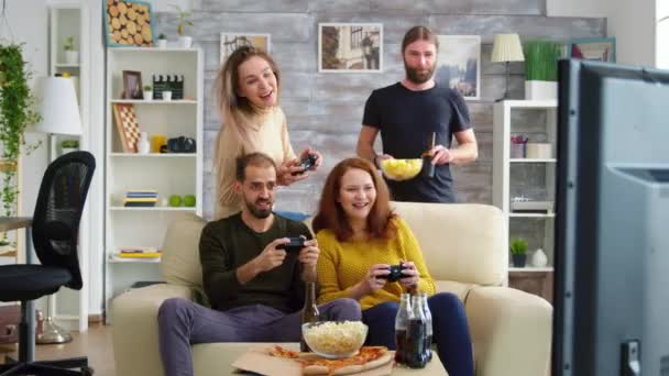 Two girl laughing while playing video games — 비디오