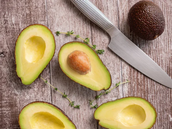 Top view fresh cutted avocado on wooden board — 스톡 사진