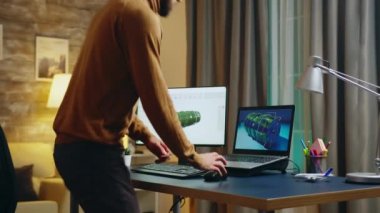 Young engineer in his home office working on developing a new turbine