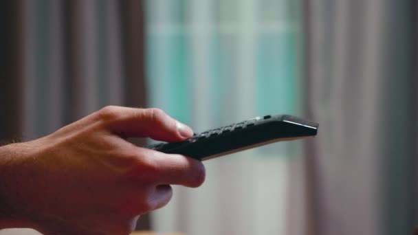 Close up of businessman using tv remote control — Αρχείο Βίντεο