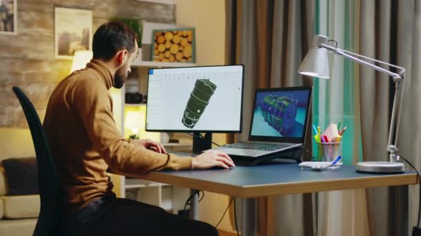 Bearded engineer sitting at his desk in home office — Stock video