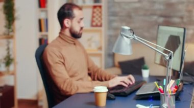 Zoom in shot of engineer taking a sip of coffee