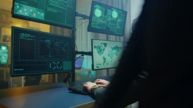 Side view of masked hacker writing a dangerous malware