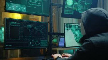 Masked hacker stealing online information from people