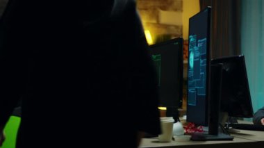 Beautiful hacker girl working with another dangerous cyber criminals