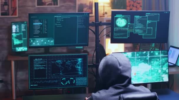 Back view of cyber terrorist using supercomputer — Αρχείο Βίντεο