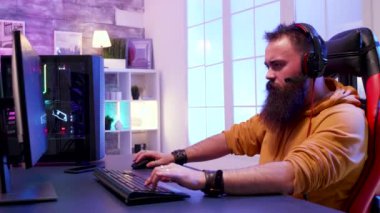 Man sitting on a gaming chair and looking at the camera