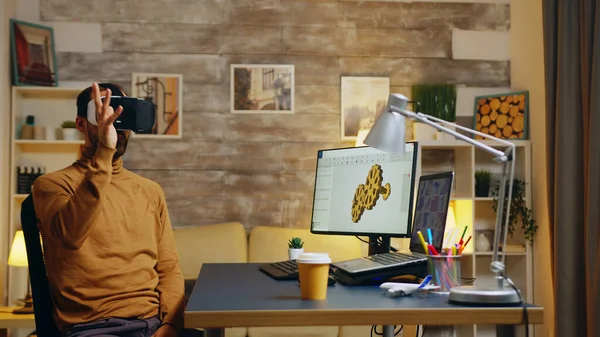 Male engineer working in his home office on a new technology — 스톡 사진