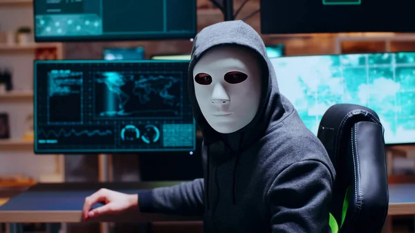 Wanted cyber criminal wearing a white mask — Stock Fotó