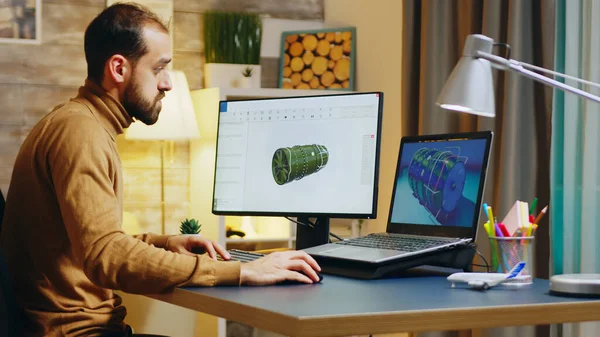 Bearded engineer sitting at his desk in home office — Stockfoto