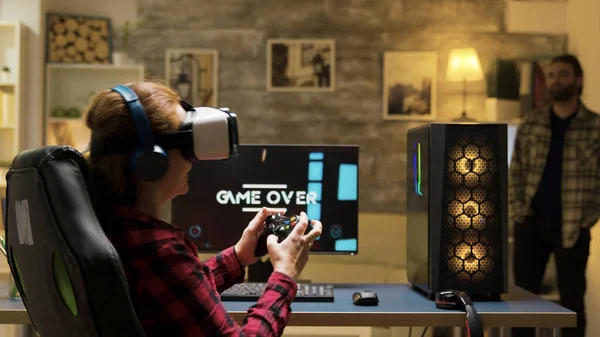 Woman relaxing playing video games using vr headset