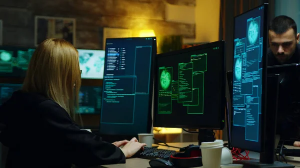 Beautiful hacker girl working with another dangerous cyber criminals — Φωτογραφία Αρχείου
