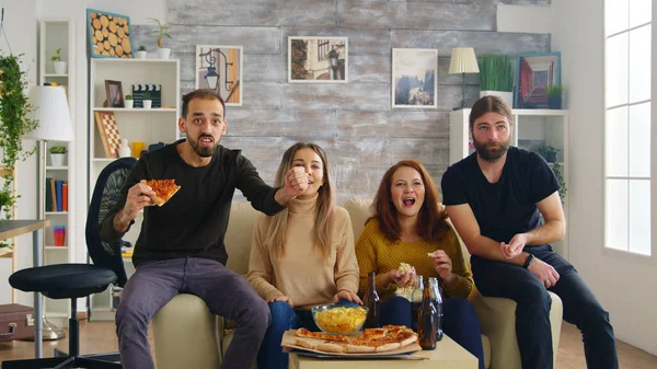 Group of friends happy after their favorite football team wins