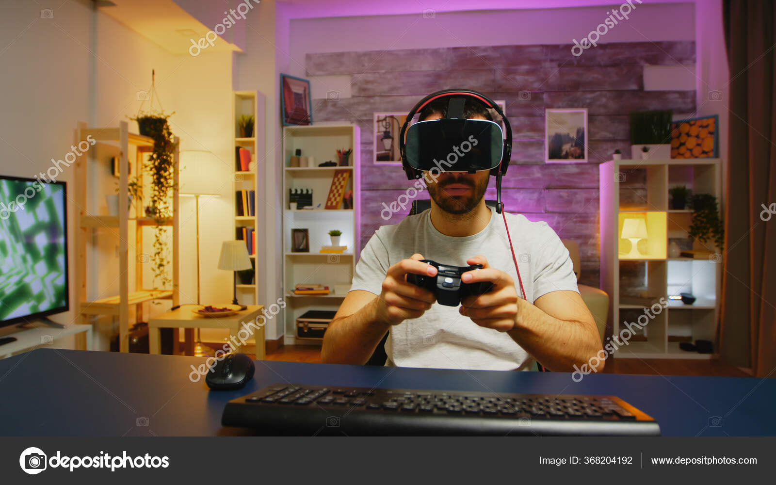 Gamer using vr glasses and controller to play video games. Man with virtual  reality goggles holding joystick in front of computer, playing online game.  Player having fun with games Stock Photo 