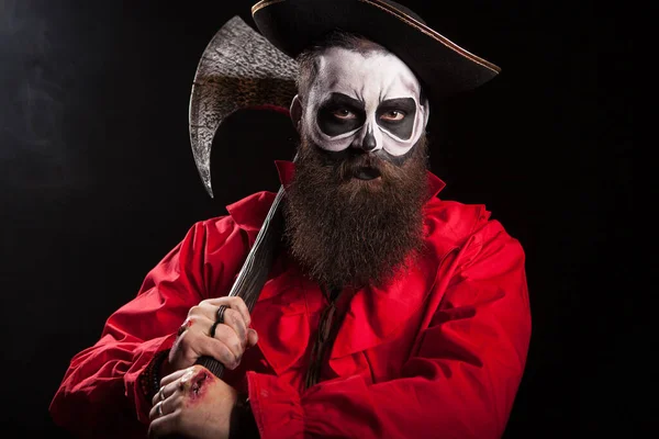 Medieval captain holding an axe over black background — Stock Photo, Image