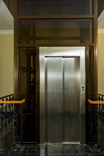 Glass elevator shaft at the entrance — Stock Photo, Image