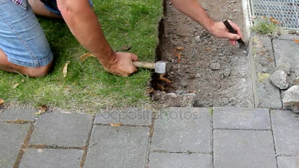 Worker Prepares Place For Laying of Concrete Paving Slabs — Stock Footage Worker Prepares Place For Laying of Concrete Paving Slabs Royalty Free Stock Footage