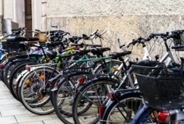 Bicycle parking in one of the medieval streets of Salzburg. Blurred view — Stock Photo, Image