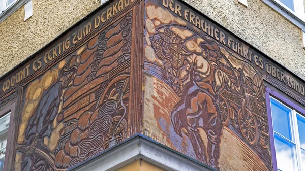 Salzburg. Facade of an ancient building with a bas-relief with inscriptions — Stock Photo, Image