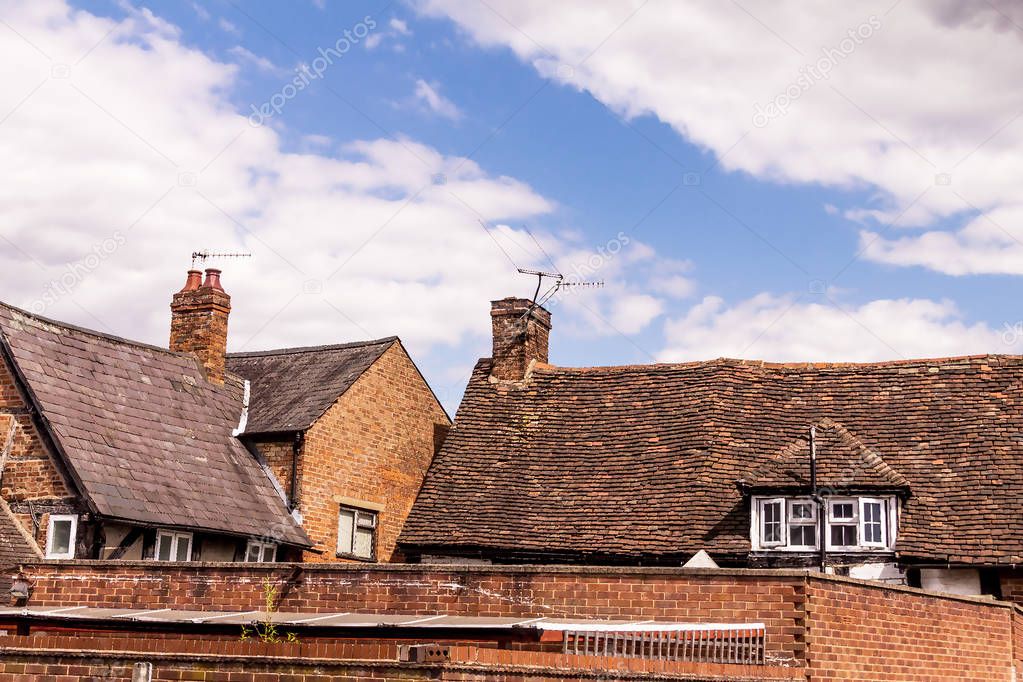 Vintage red brick rural buildings in English style