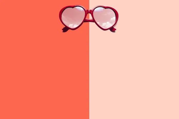 Heart sunglasses on pastel background