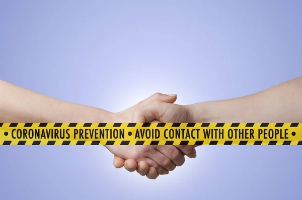 Coronavirus covid-19 concept: a safety tape with advice to avoid contact with other people in front of a man and a woman shaking hands on blue gradient background.