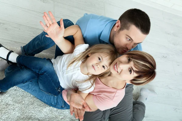 Happy family mother and father playing with baby at home. Unusually view from above. — Stock Photo, Image