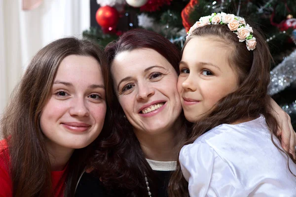 Happy mother and daughters on christmas — Stock Photo, Image